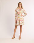 Woman wearing a floral dress on a white background