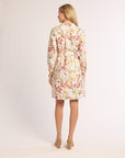 Woman wearing a floral dress on a white background