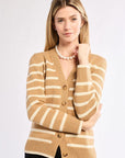 Woman wearing a striped cardigan with a white background