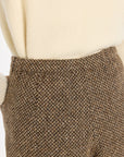 Close-up of the waistband and brown woven texture of the Tobacco Tweed Archer Shorts, photographed against a plain white studio background.