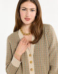 A woman modeling the Camel Tri-Color Check Classic Cashmere Cardigan with camel trousers, mid-length front view, photographed against a plain white studio background.