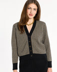 A woman modeling the Black Tri-Color Check Classic Cashmere Cardigan with black trousers, front view, photographed against a plain white studio background.