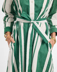 Green and white striped dress with a belt on a white background