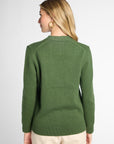 Back view: Woman wearing Forest Green v-neck button up cardigan in front of white background.