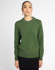 Front view: Woman wearing Forest Green crewneck sweater in front of white background.