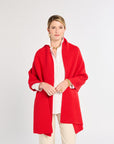 Woman wearing a red scarf on a white background