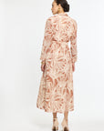 Woman wearing a floral dress on a white background