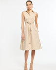 Woman wearing a beige striped dress on a white background
