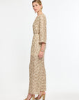 Woman wearing a beige floral dress on a white background