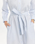 Blue and white striped dress with a belt on a white background
