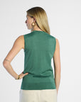 Back profile of a woman wearing a green sleeveless sleeve against a white background