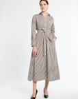 Woman wearing a striped dress on a white background