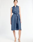 Woman wearing a blue dress with a white background