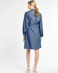 Woman wearing a blue dress on a white background