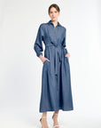 Woman wearing a blue dress on a white background