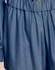 Close-up of blue denim pants with an elastic waistband