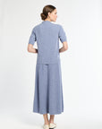 Woman wearing a blue outfit on a white background