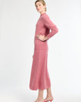 Woman wearing a pink outfit on a white background