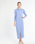 Woman wearing a light blue dress on a white background
