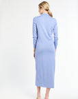 Woman wearing a light blue dress on a white background