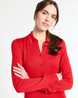 Woman wearing a red dress against a white background