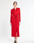 Woman wearing a red dress with a belt on a white background