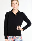 Woman wearing a black sweater with a white background