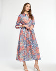 Woman wearing a floral dress on a white background