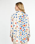 Woman wearing a floral blouse on a white background