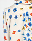 Close-up of a colorful floral patterned shirt with a white background