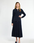Woman wearing a navy blue suit on a white background