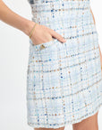 Light blue and white patterned dress with a pocket on a white background