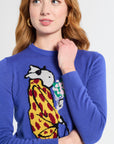 woman wearing a blue sweater with a colorful graphic design on a white background
