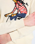 Close-up of a sweater with a colorful giraffe design