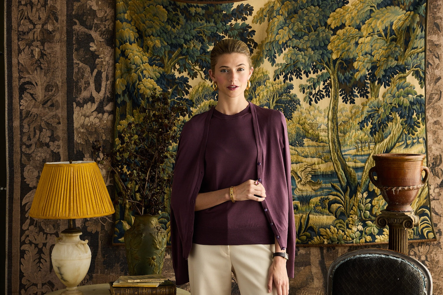 Woman wearing mulberry silk shirt, draped with a mulberry silk cardigan.