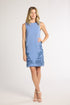 Woman modeling a blue hand-crochet dress with blue fern embroidery on a white background