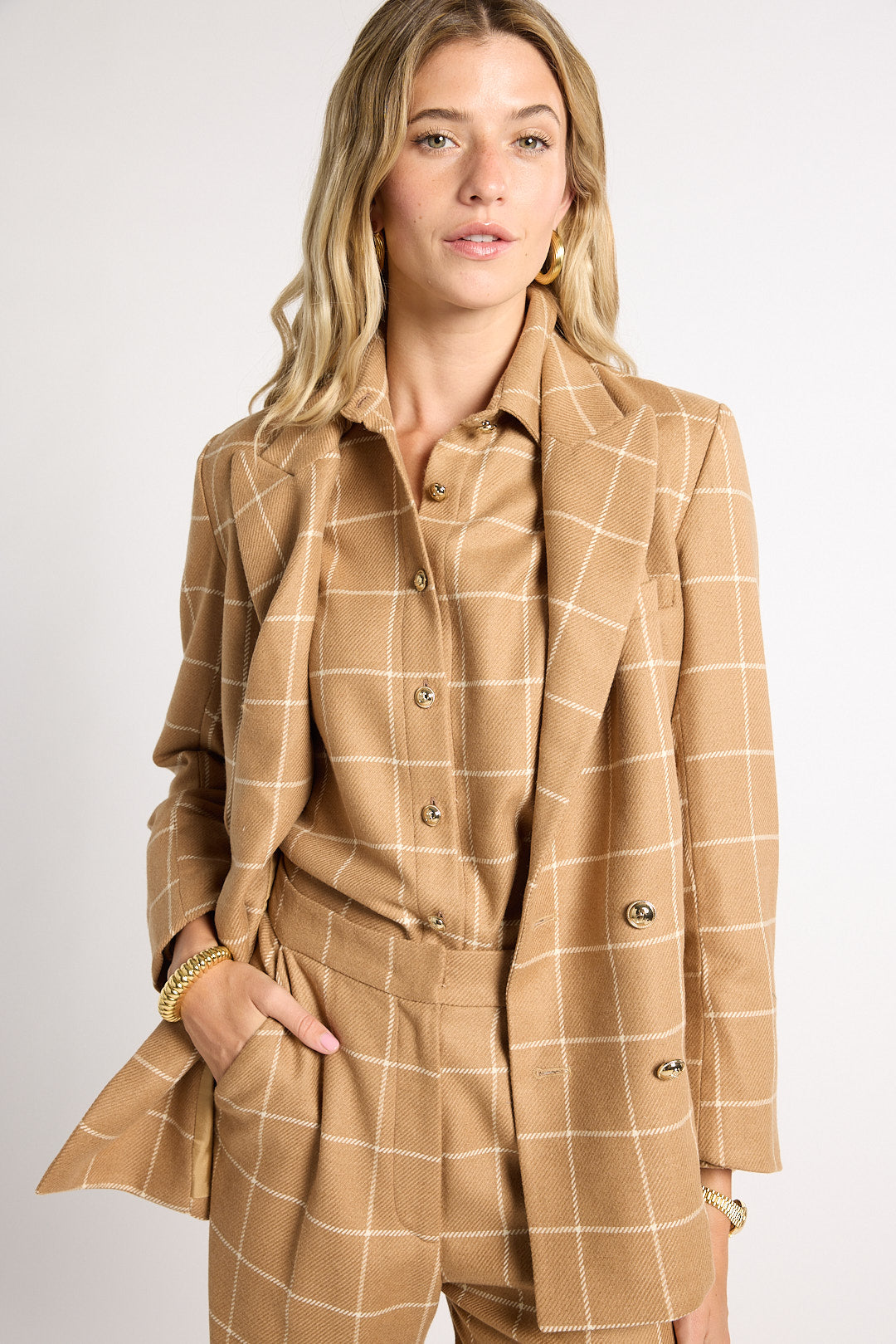 Woman modeling tan outfit