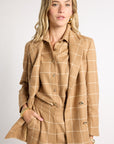 Woman modeling tan outfit