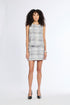 Woman wearing a patterned set on a white background