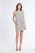 Woman wearing a sleeveless patterned dress on a white background