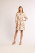 Woman wearing a floral dress on a white background