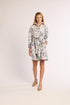 Woman wearing a floral dress on a white background