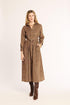 Woman wearing a brown checkered coat on a white background