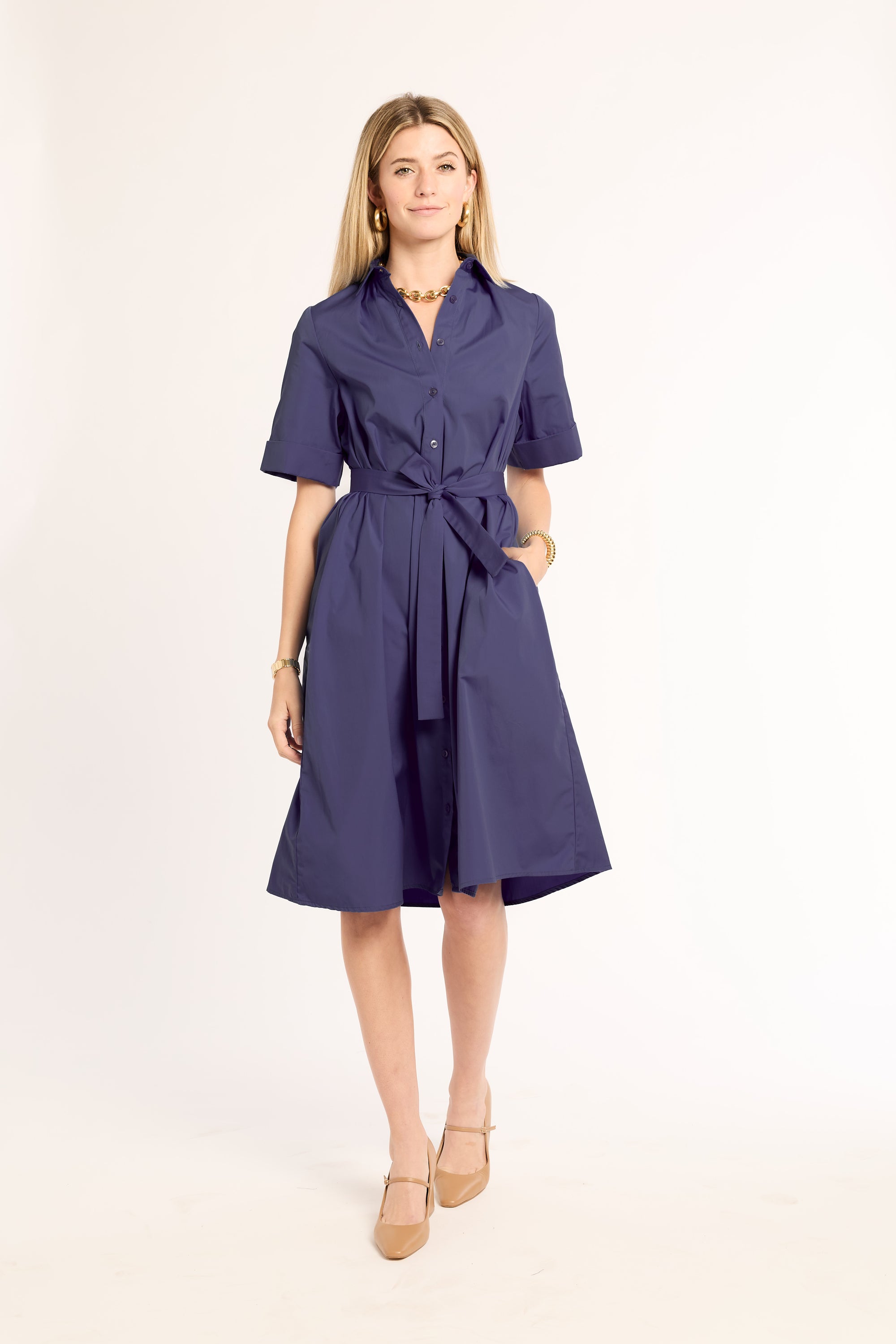 Woman wearing a blue dress on a white background