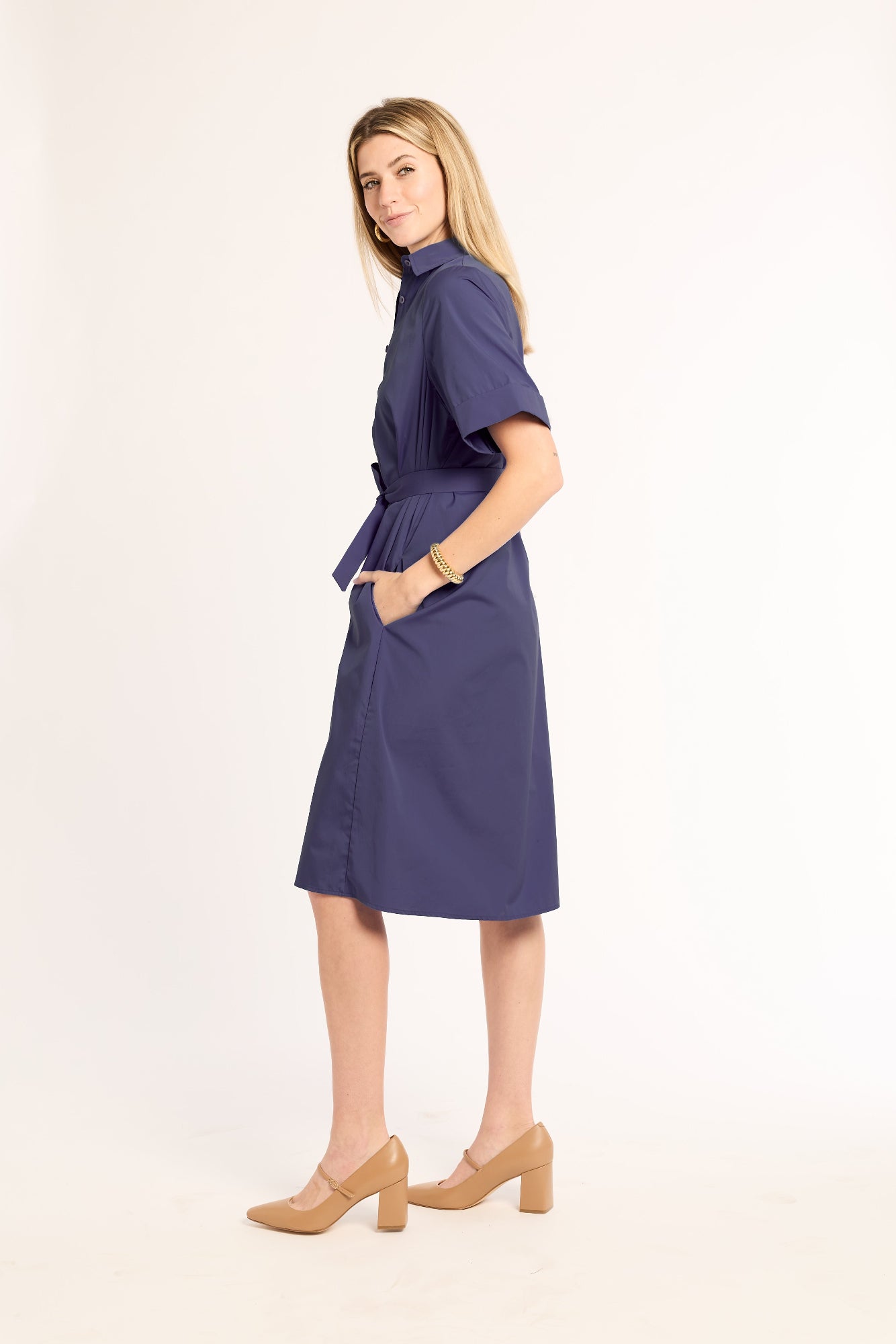 Woman wearing a blue dress on a white background