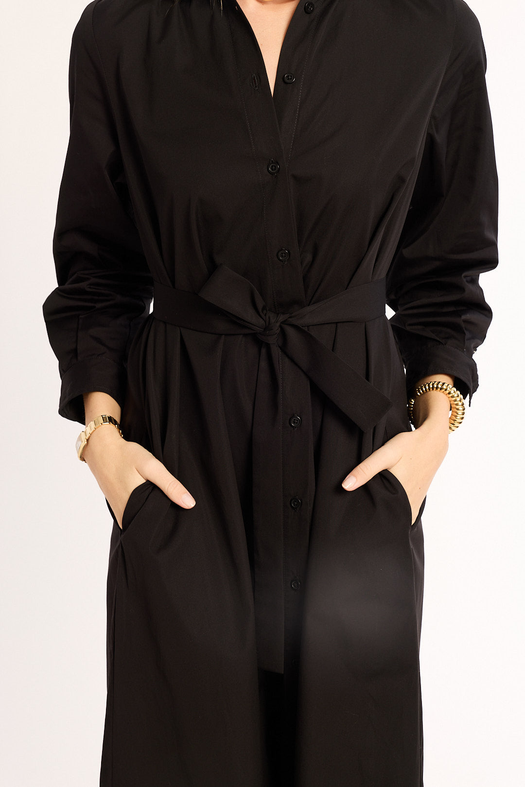 Black dress with a tie waist on a white background