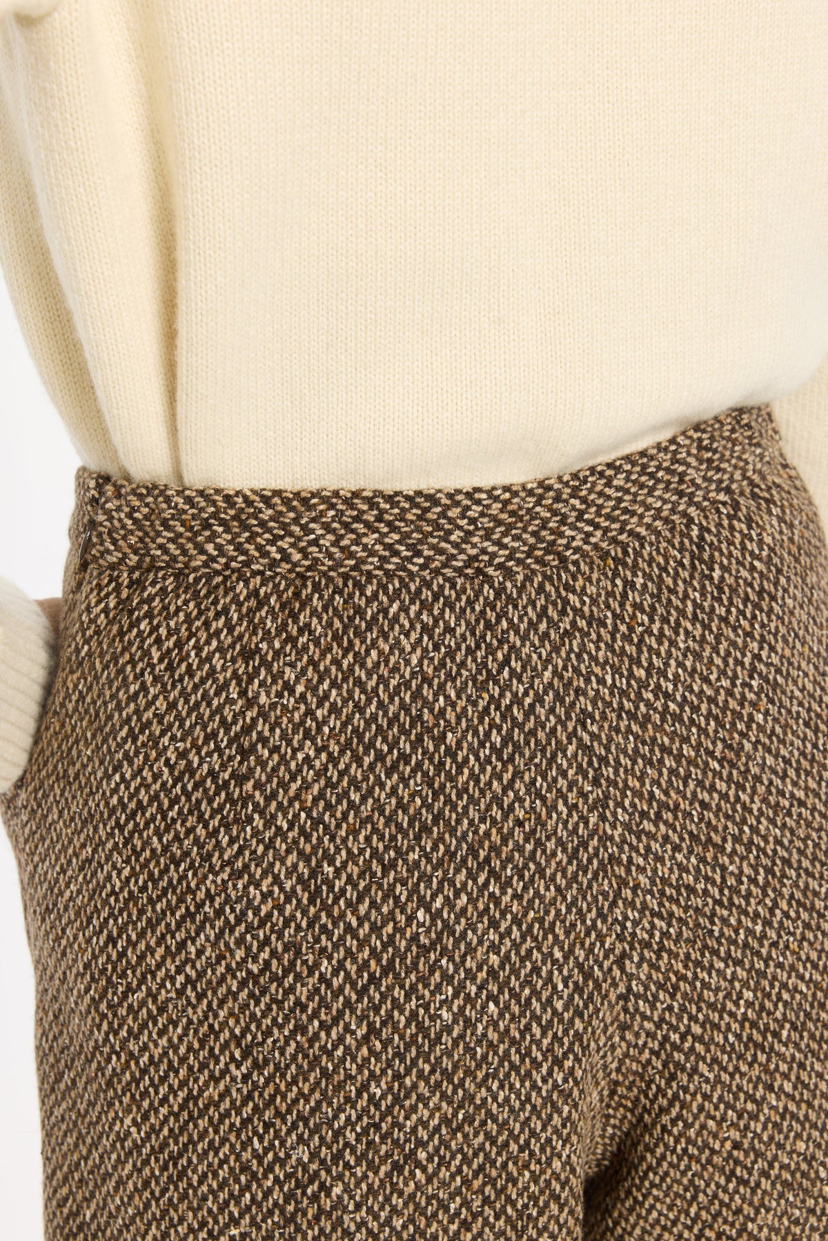 Close-up of the waistband and brown woven texture of the Tobacco Tweed Archer Shorts, photographed against a plain white studio background.