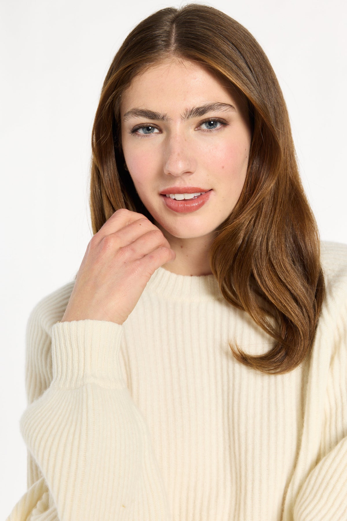 Close-up of the ribbed crew neckline and shoulder of the cream Baby Cashmere Ribbed Crewneck, photographed against a plain white studio background.