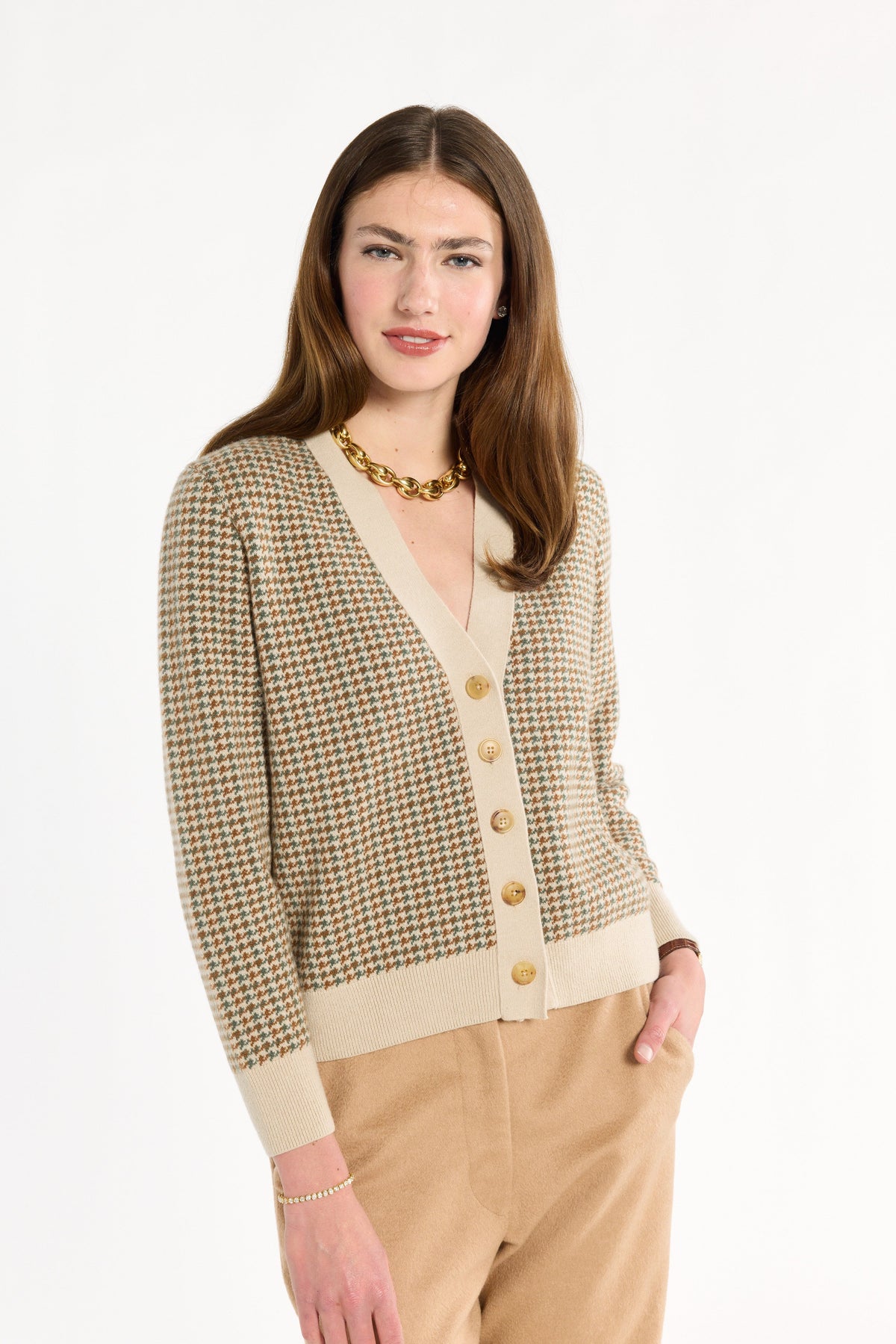 A woman modeling the Camel Tri-Color Check Classic Cashmere Cardigan with camel trousers, front view, photographed against a plain white studio background.