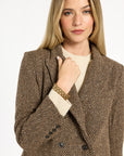 Close-up of the lapels, double-breasted buttons, and brown woven texture of the Tobacco Tweed Cynthia Blazer, photographed against a plain white studio background.